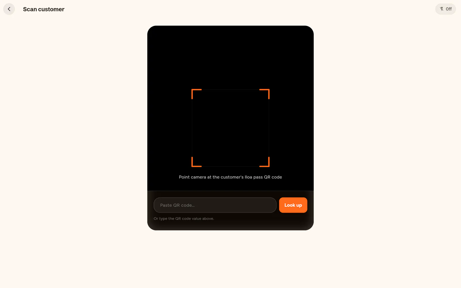 Screenshot of the Iloa Business web app: the Scan customer screen, with the camera frame pointed at a customer's Iloa ID QR code and a field to paste the code instead.